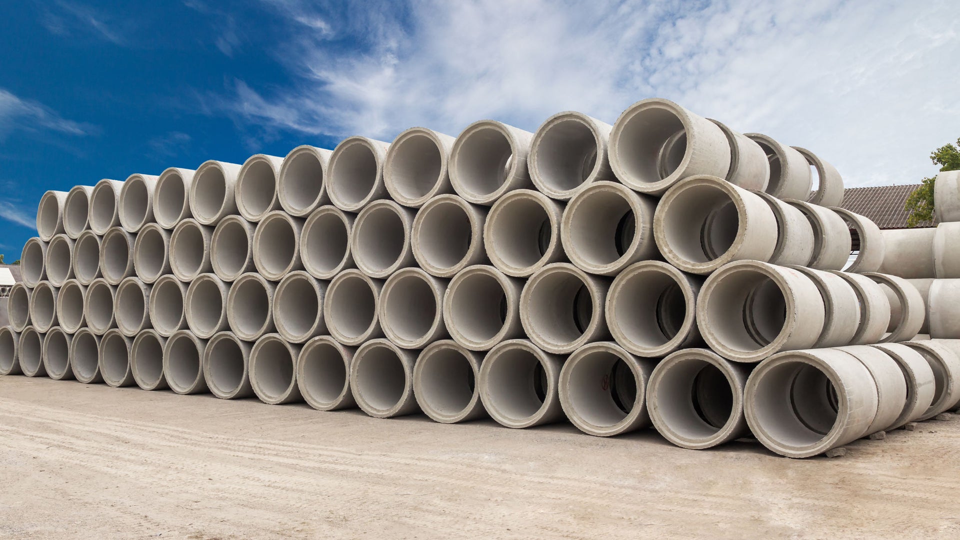 Precast concrete pipe segments stacekd on top of each other