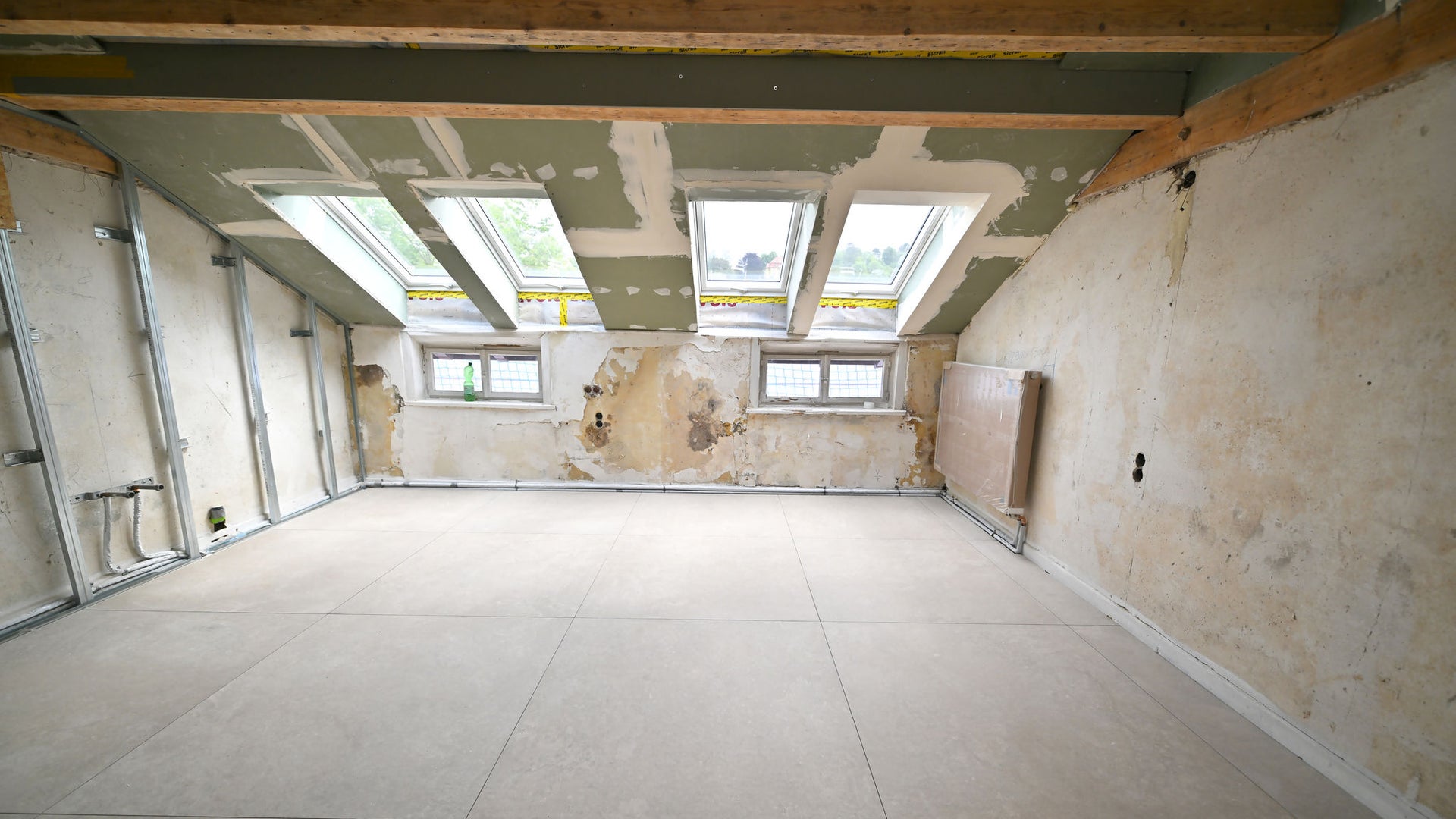 Unfinished attic with skylight windows