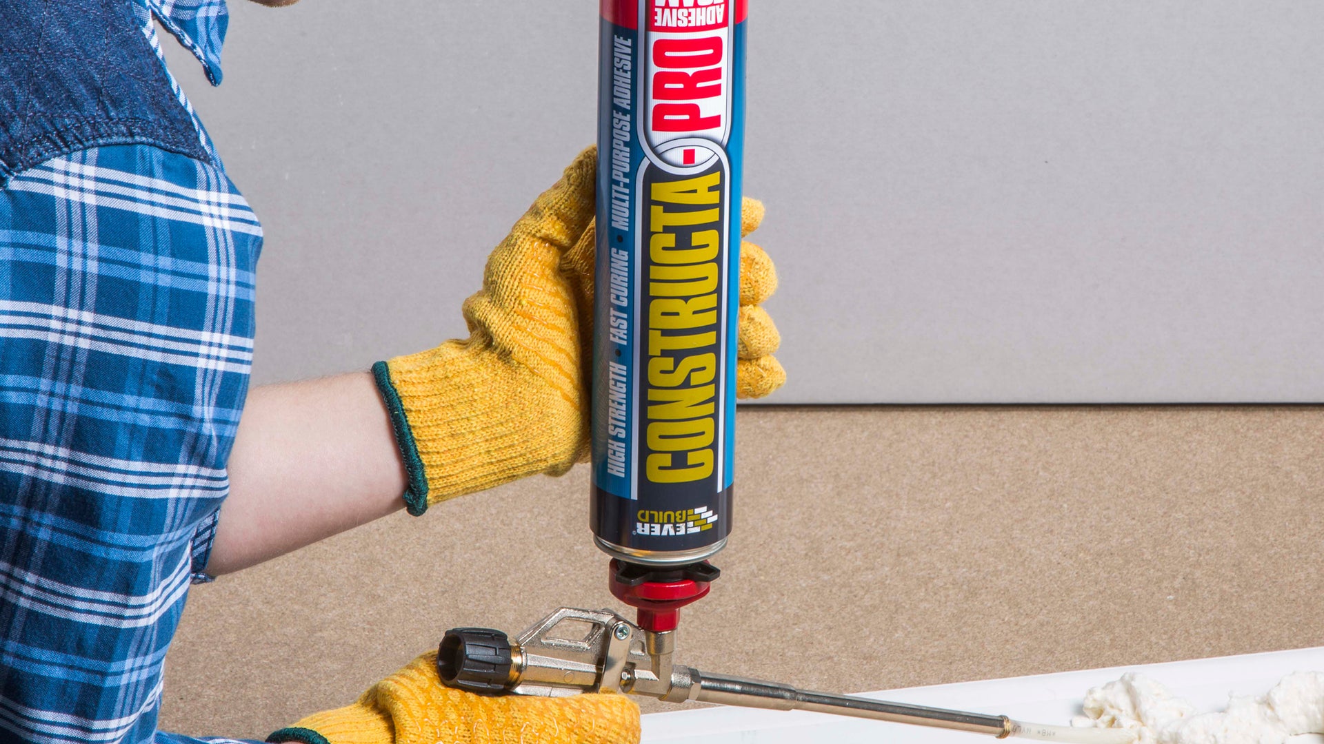 Person applying Constructa Pro adhesive foam