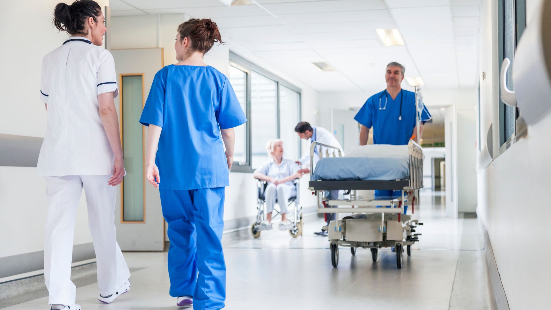 Healthcare professionals in hospital corridor
