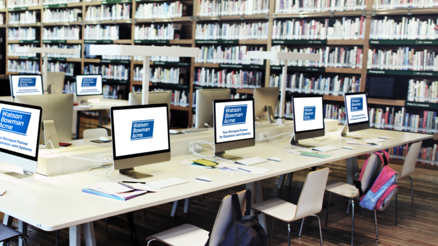 Modern library with rows of desktop computers