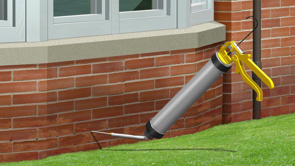 Borehole injection in a brick wall to combat rising damp