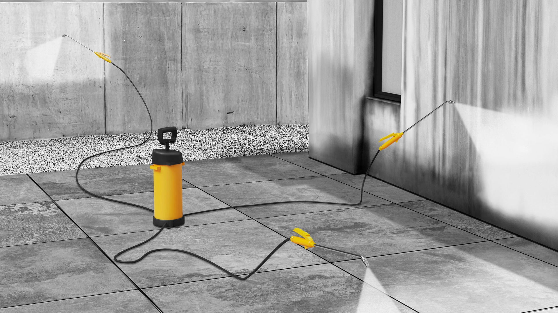 Image of a wall, facade and patio with Sikagard-1250 being spray applied to them for stain removal