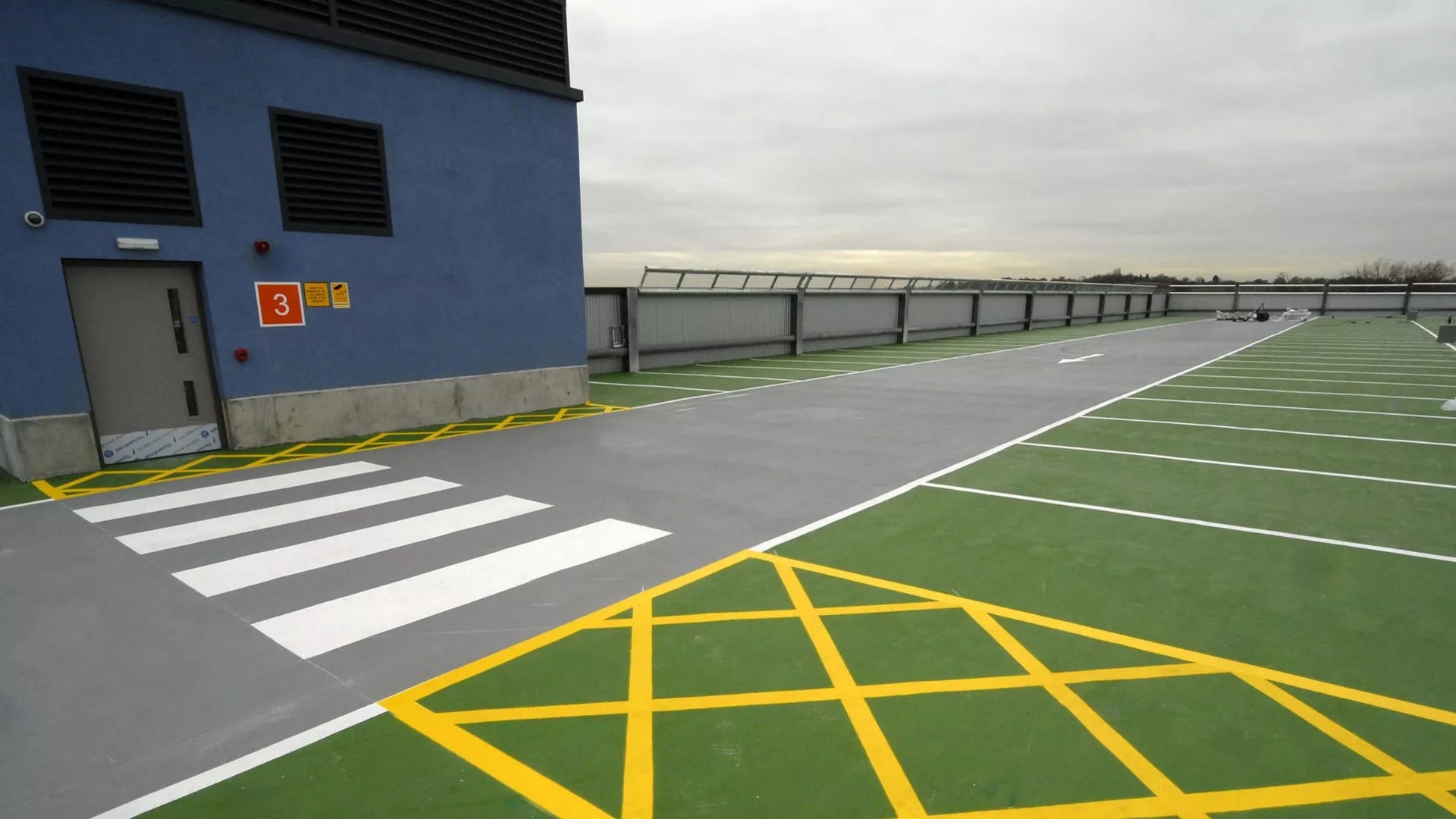Empty rooftop parking lot with markings