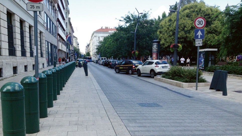Urban street with traffic and signage