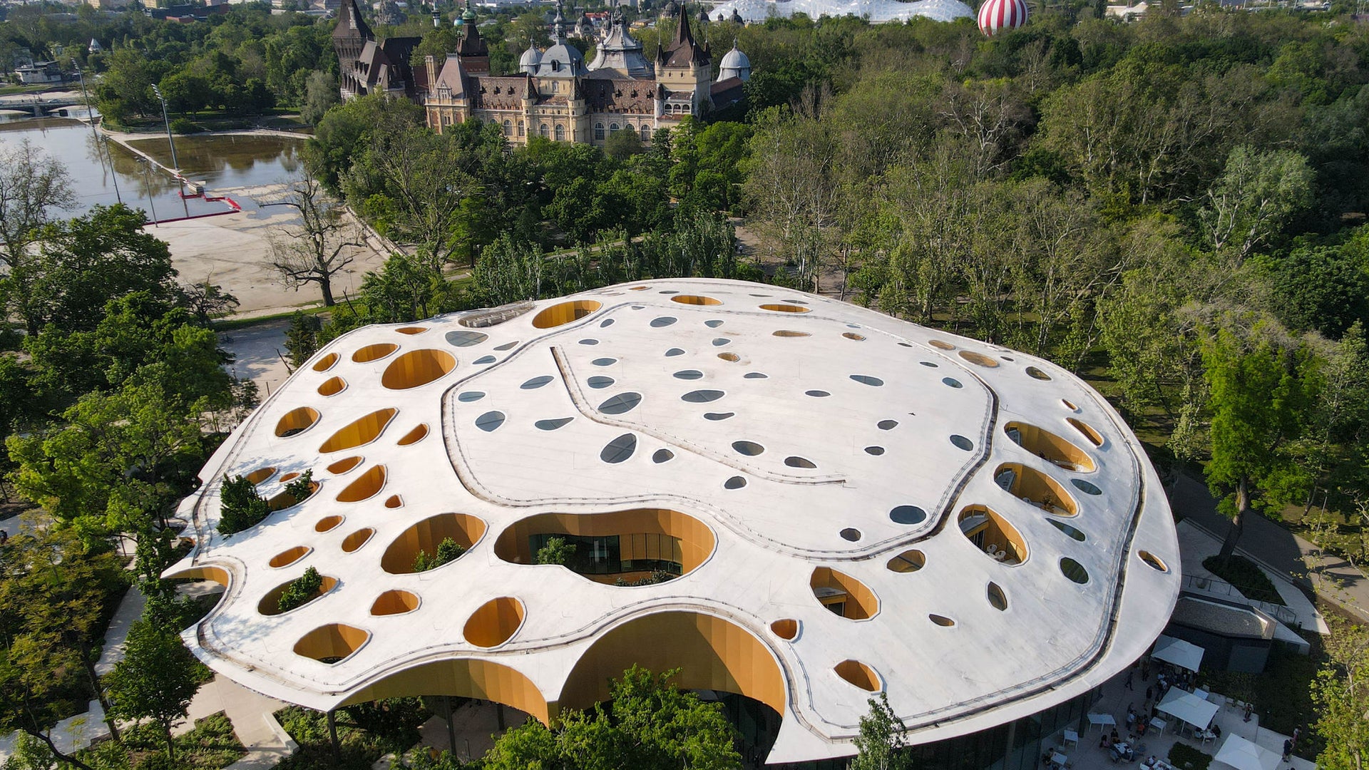 Futuristic pavilion with organic perforated roof