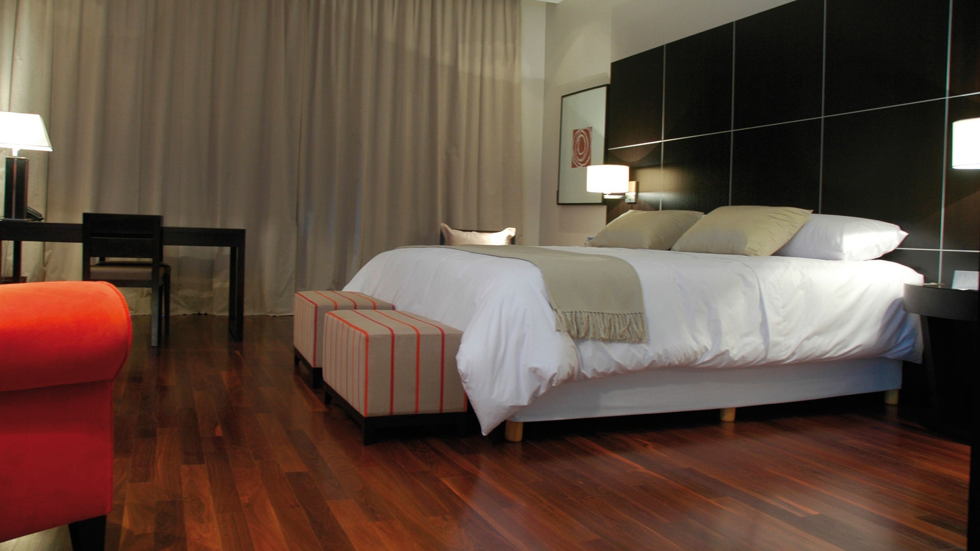 bedroom with wood floor hotel room with bed