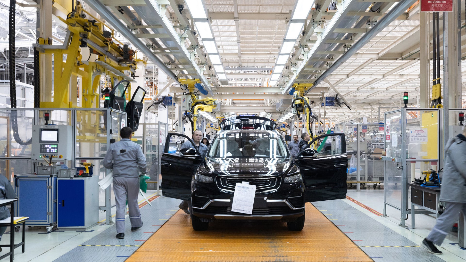 Modern car assembly line with robotic arms