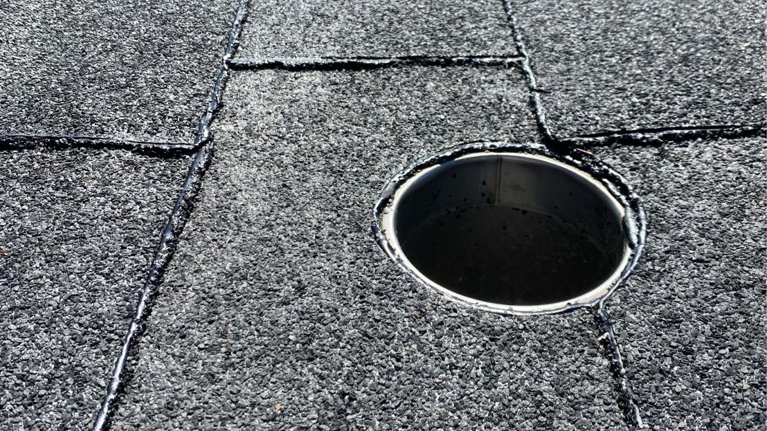Close-up of asphalt roof drainage detail