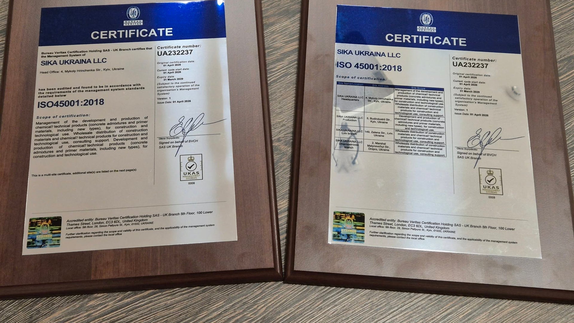 ISO 45001:2018 certificates on wooden table