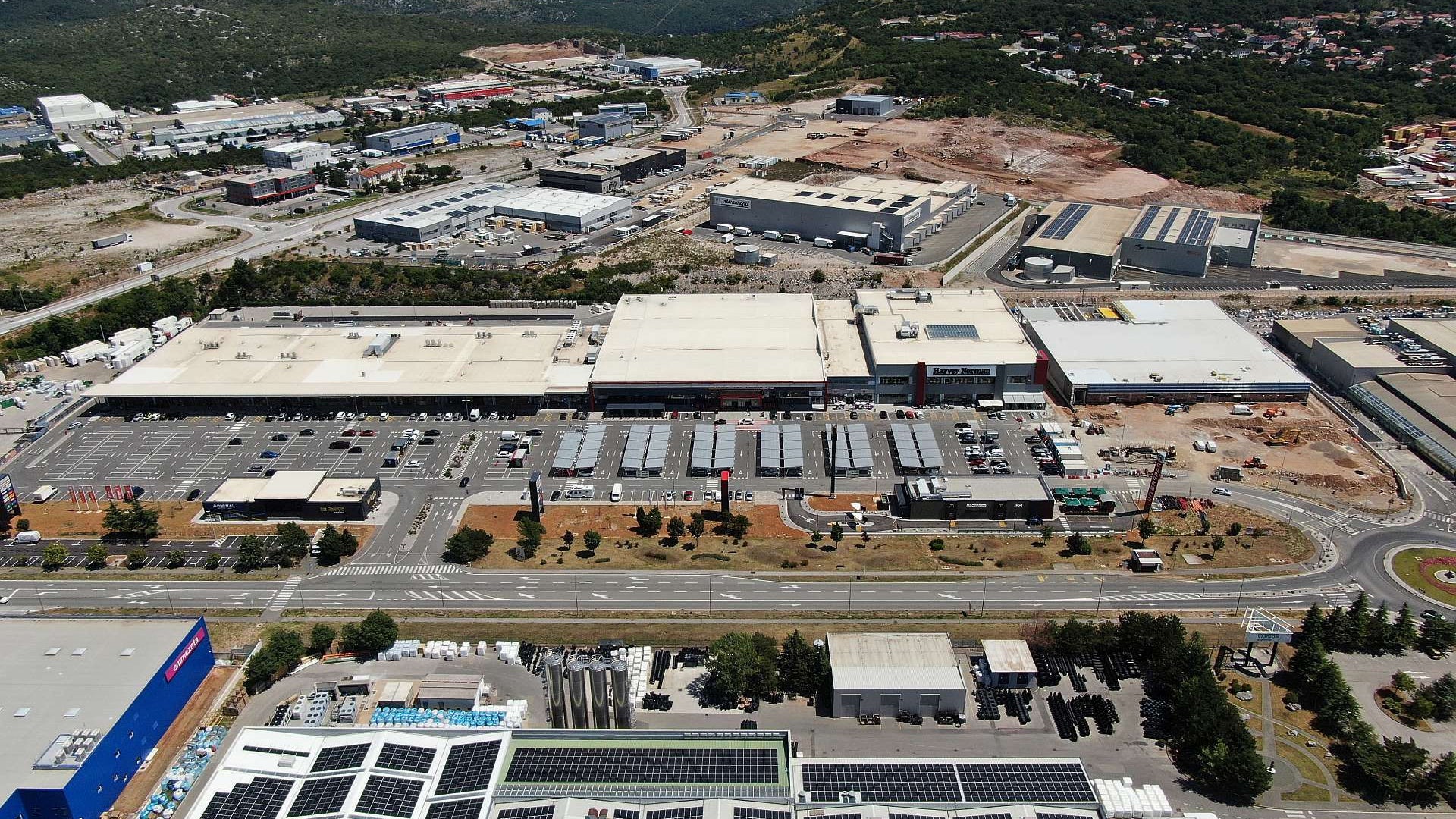 Aerial view of industrial complex with solar panels
