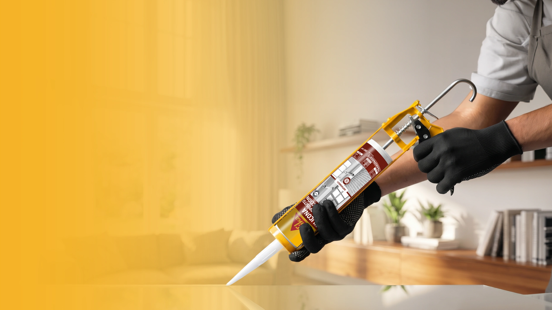 Worker applying sealant with caulking gun