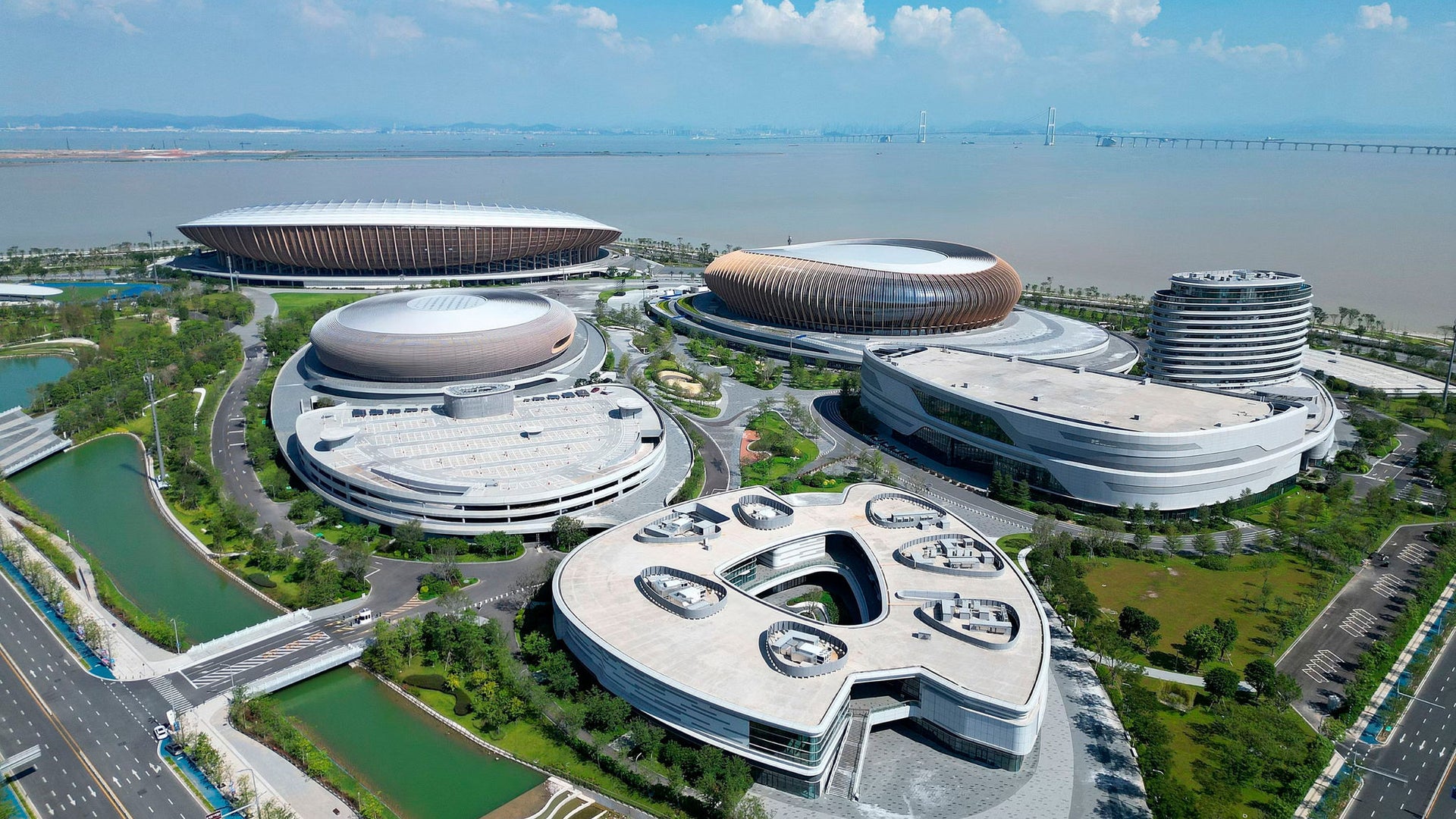 Futuristic waterfront sports and event complex