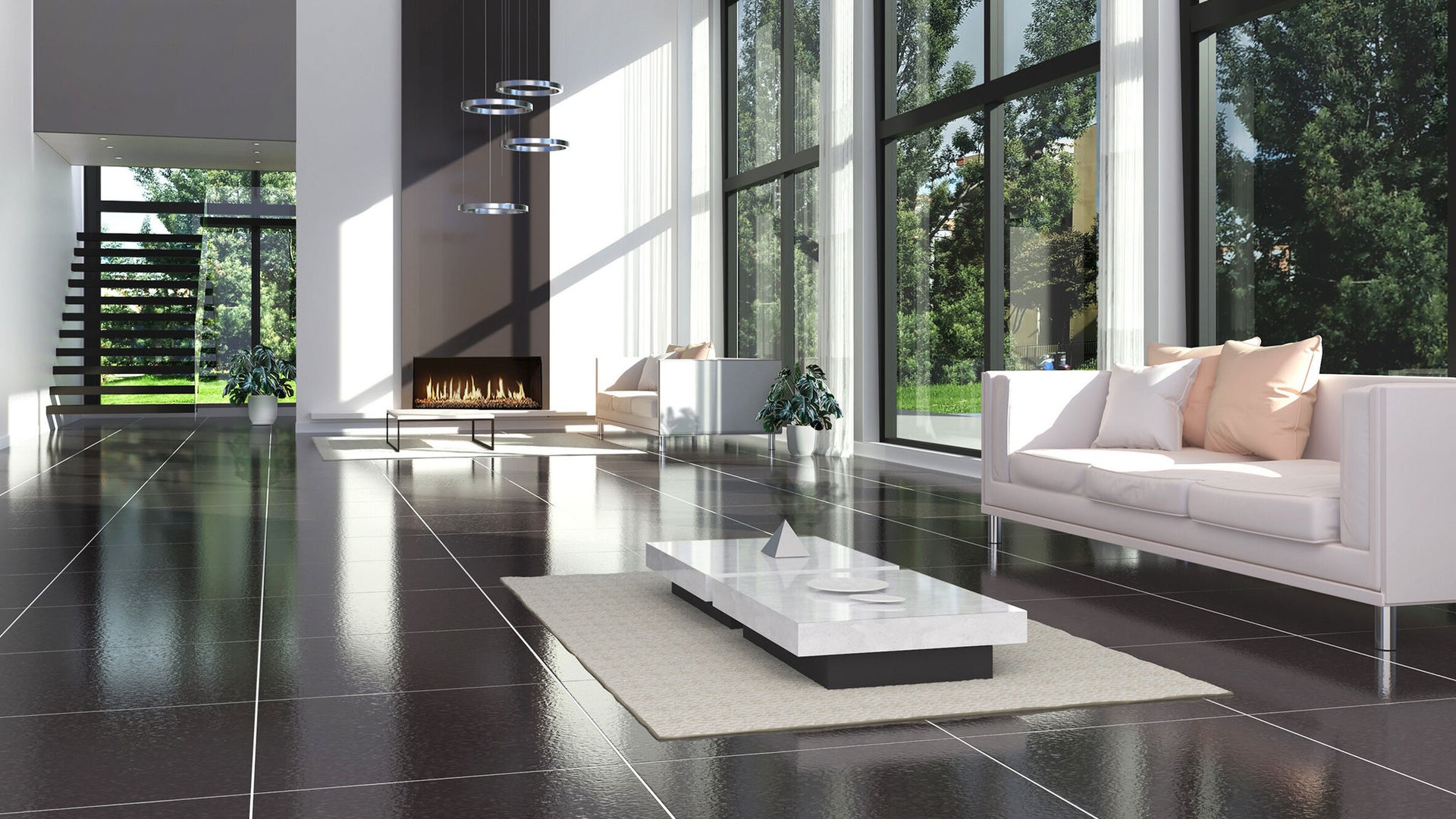 dark grey tile floor in living room with high ceiling and large windows and sunlight
