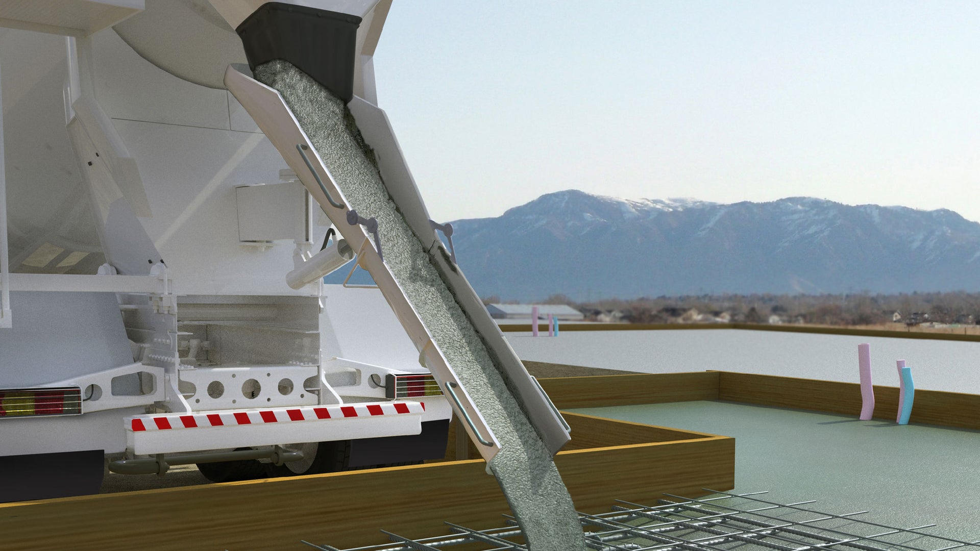 Concrete mixer vehicle empties concrete into a filling