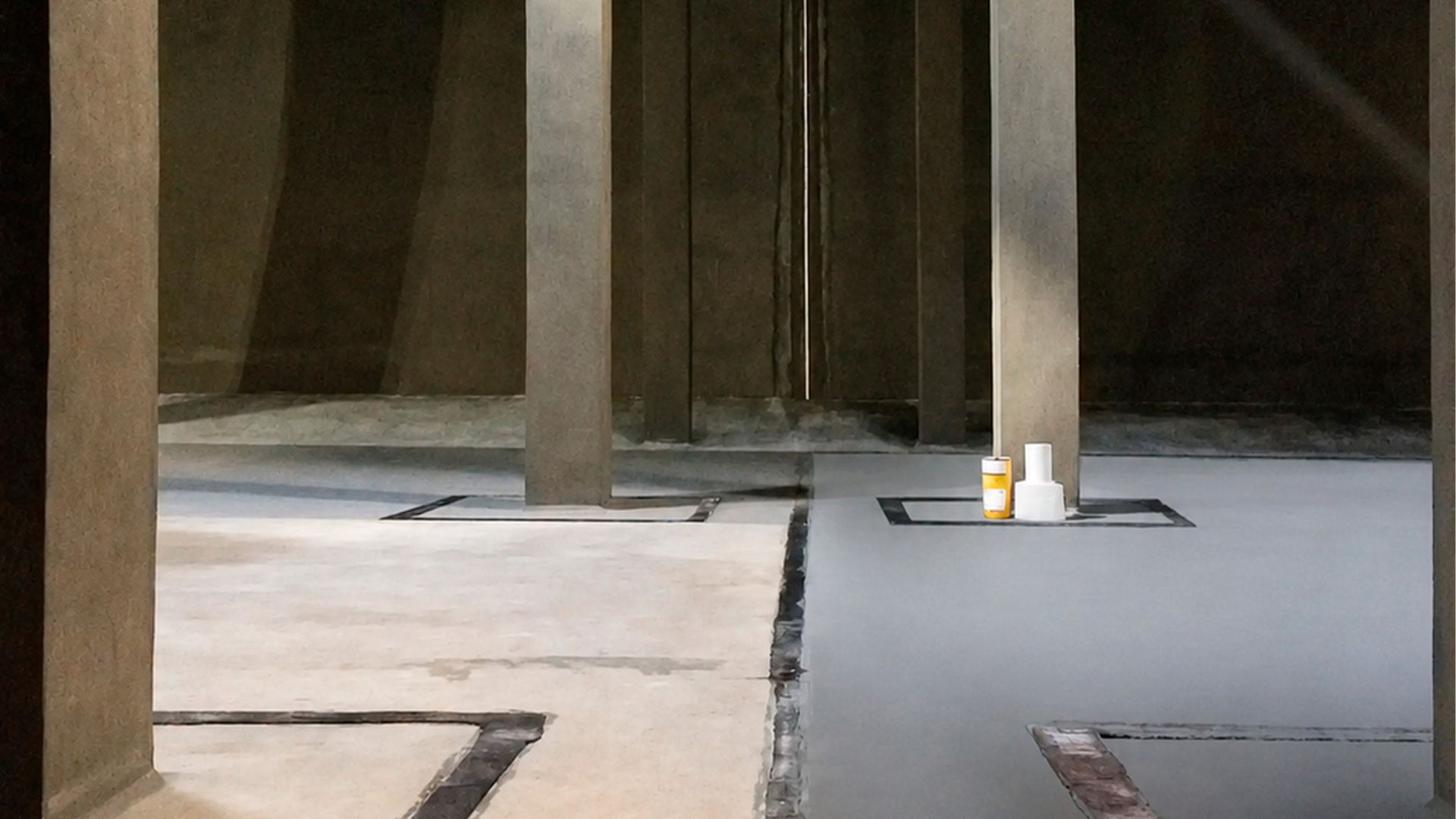 Industrial interior with concrete pillars and cans