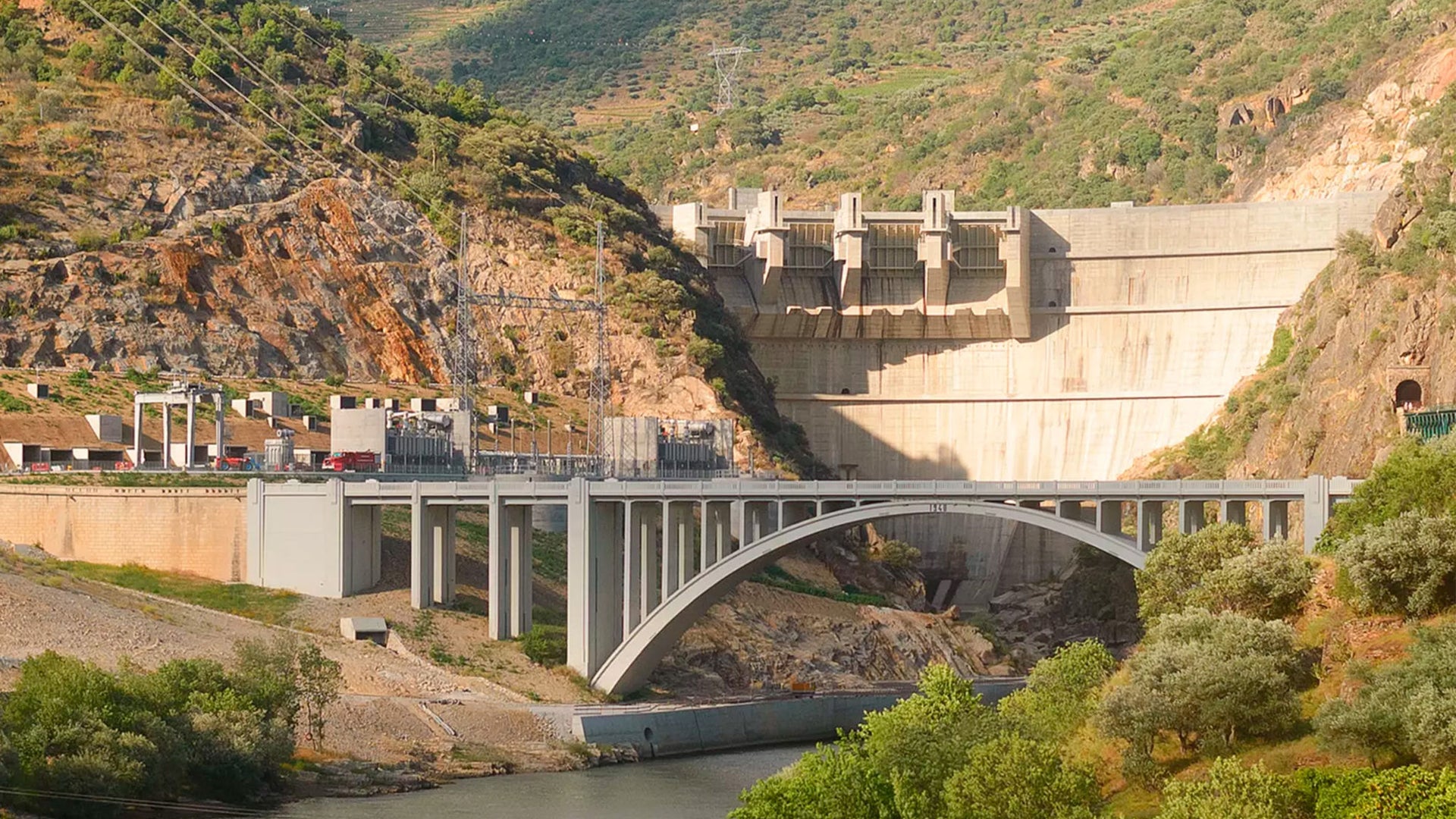 Hydroelectric dam and bridge in mountain valley