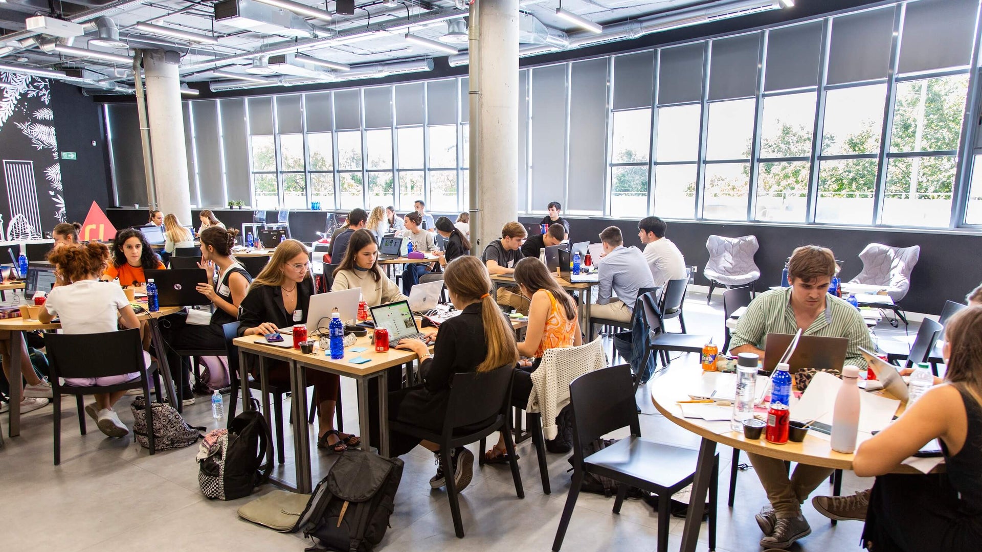 Group of students working in modern workspace