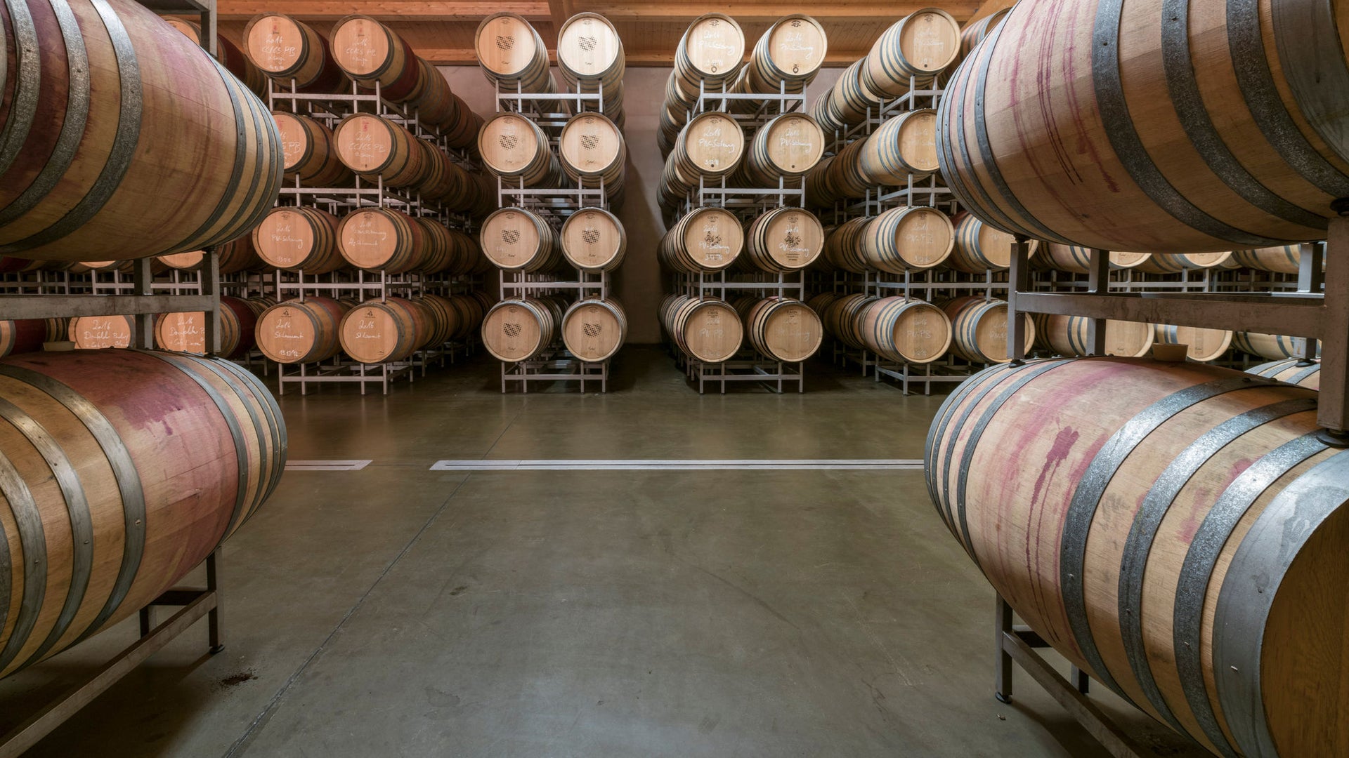 Rows of wine barrels in cellar