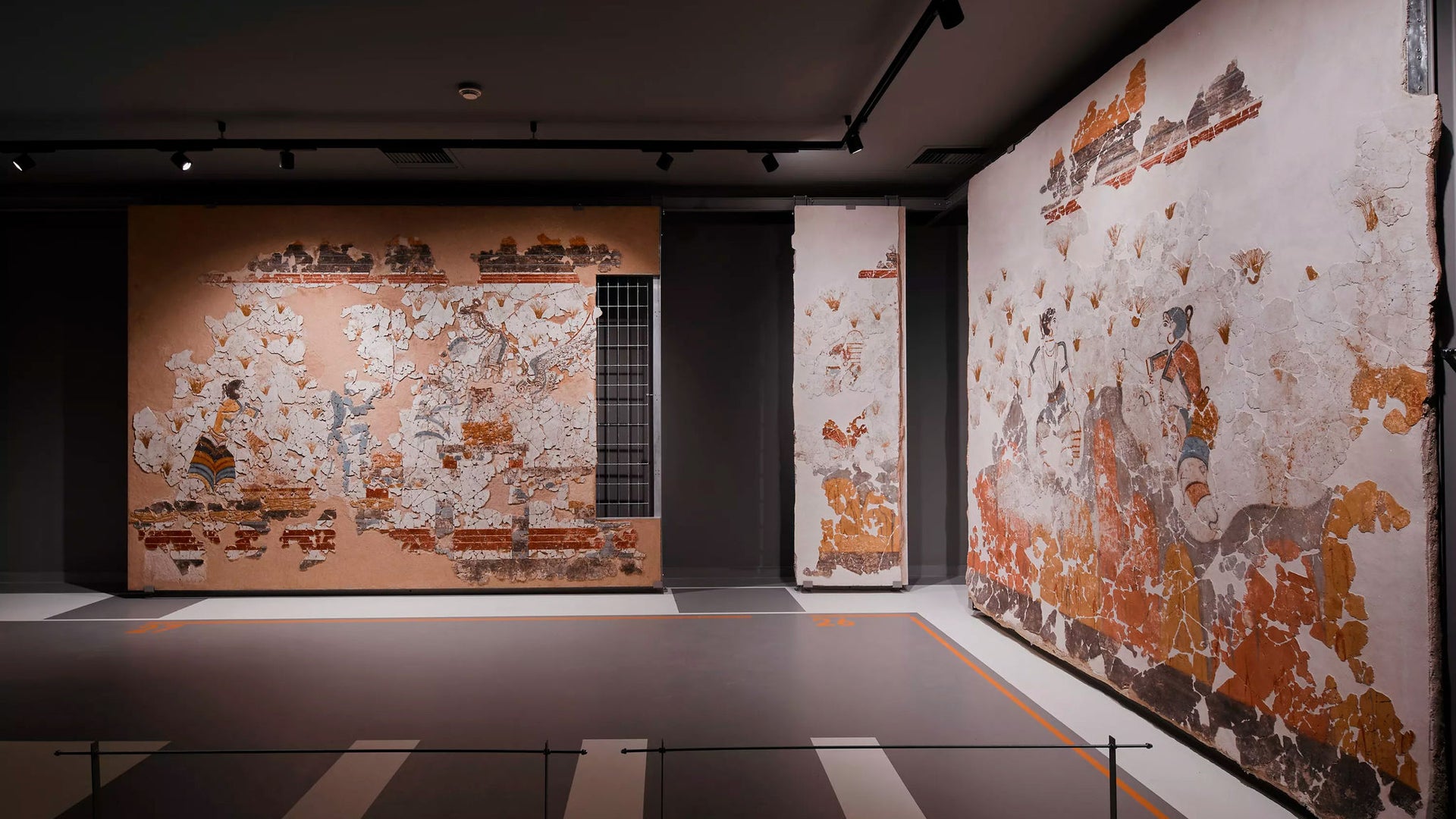 Ancient wall frescoes displayed in museum gallery