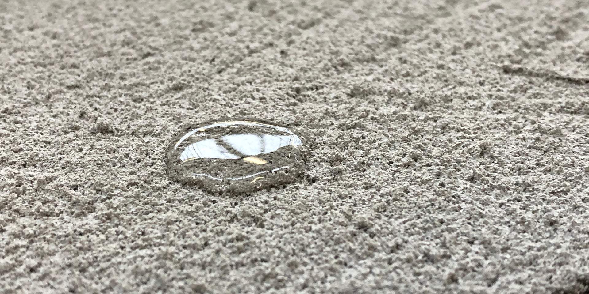 Water droplet on textured concrete surface
