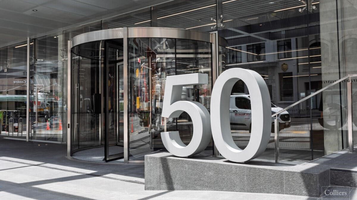 Modern building entrance with large 50 sign
