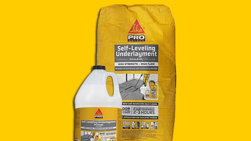 Person Applying SikaLevel Underlayment to Floor