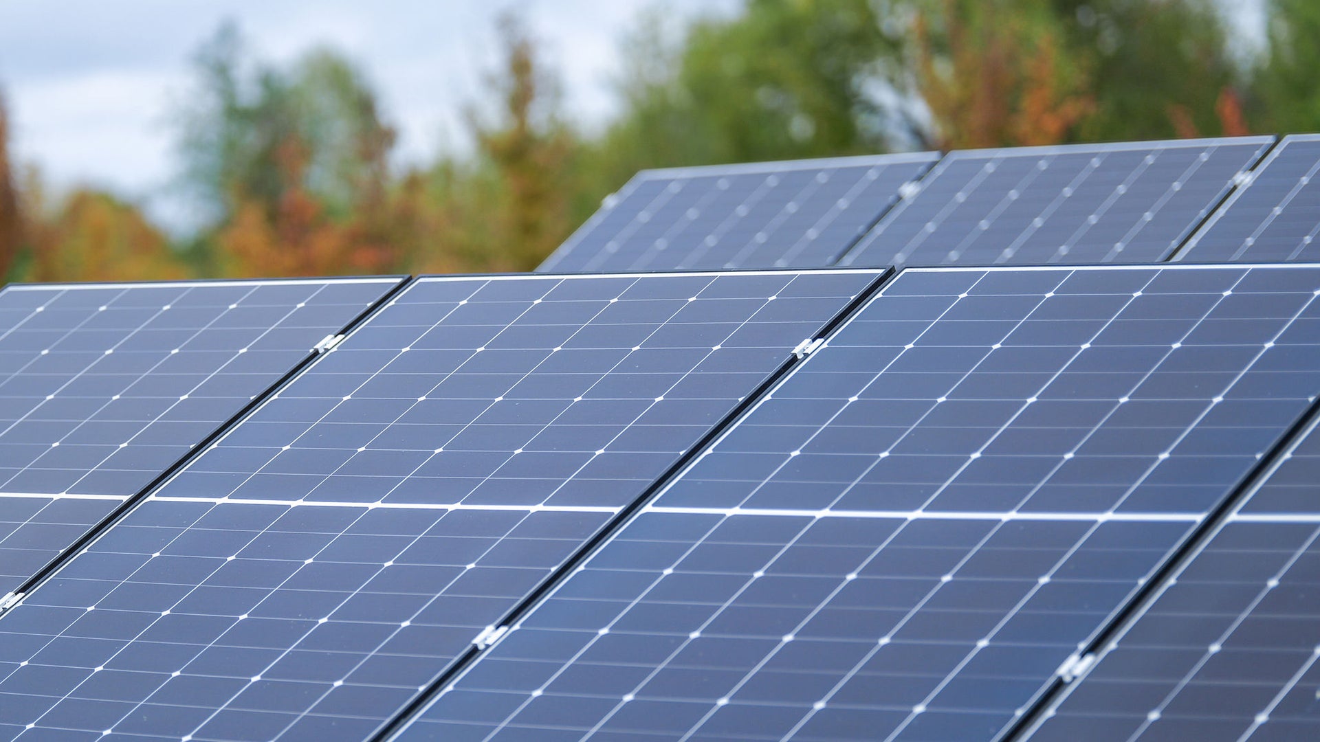 a row of solar panels on a roof