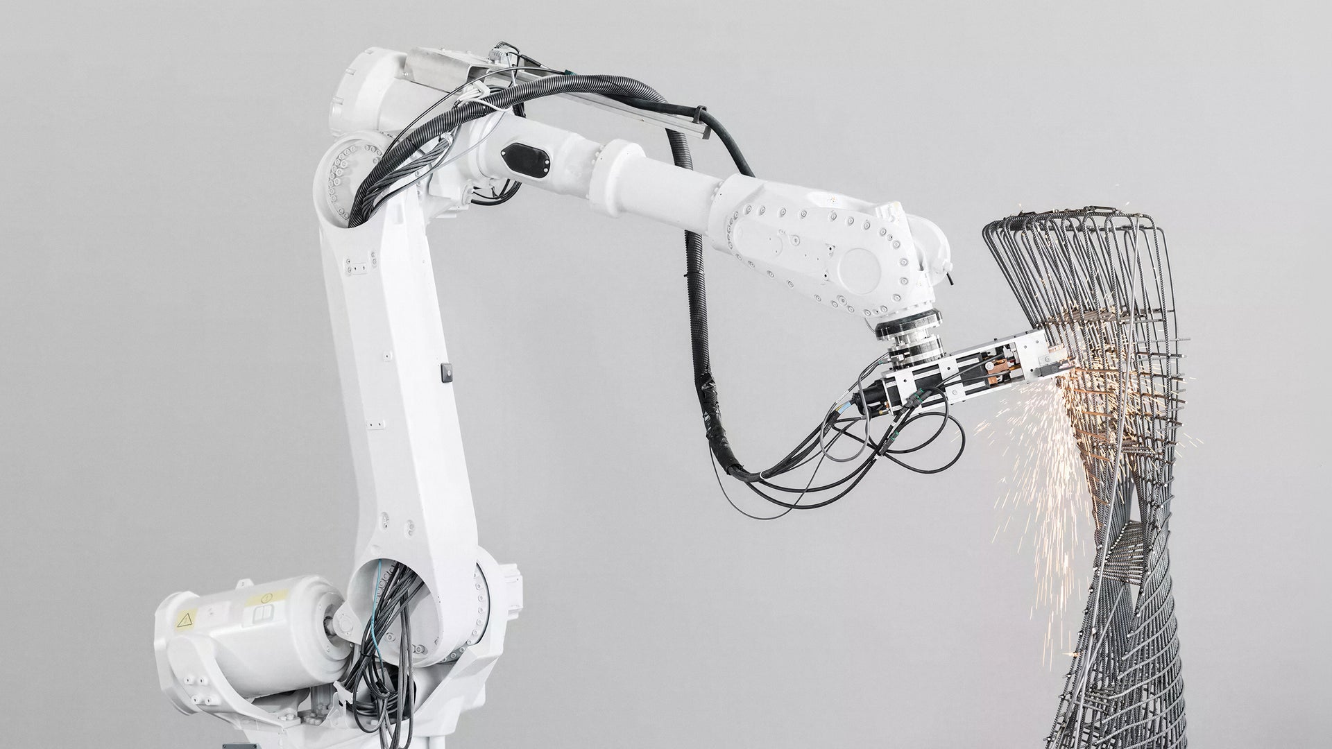 Industrial robot arm welding metal structure
