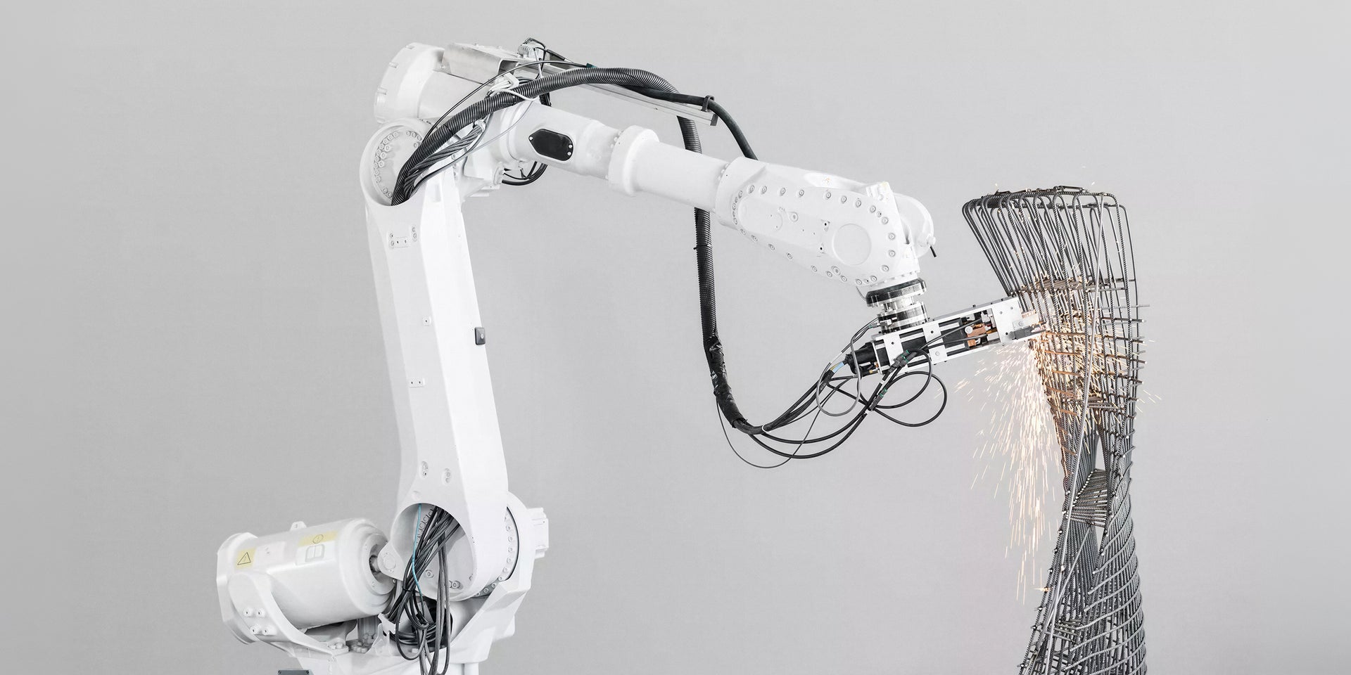 Industrial robot arm welding metal structure