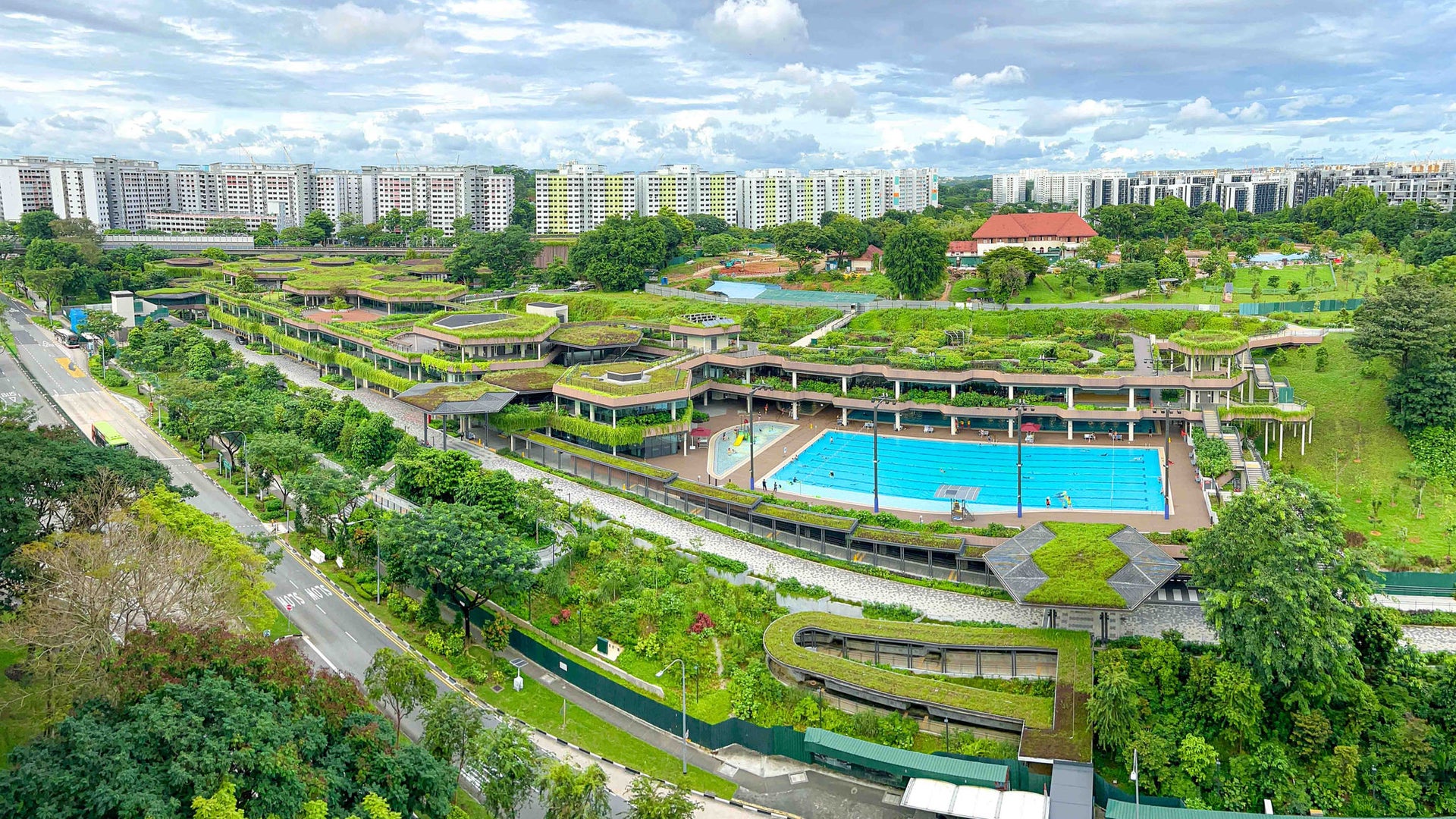 Green rooftop complex with outdoor pool