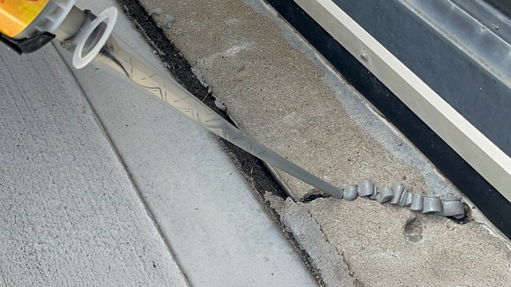 Applying sealant to cracked concrete joint