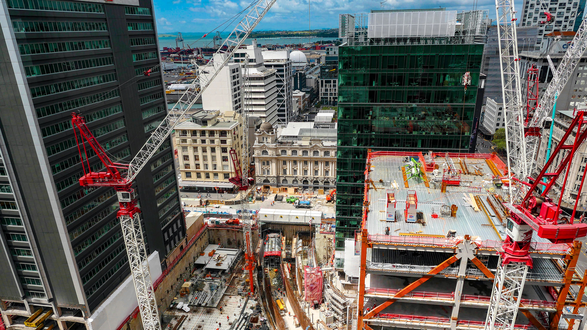 Large urban construction site with cranes