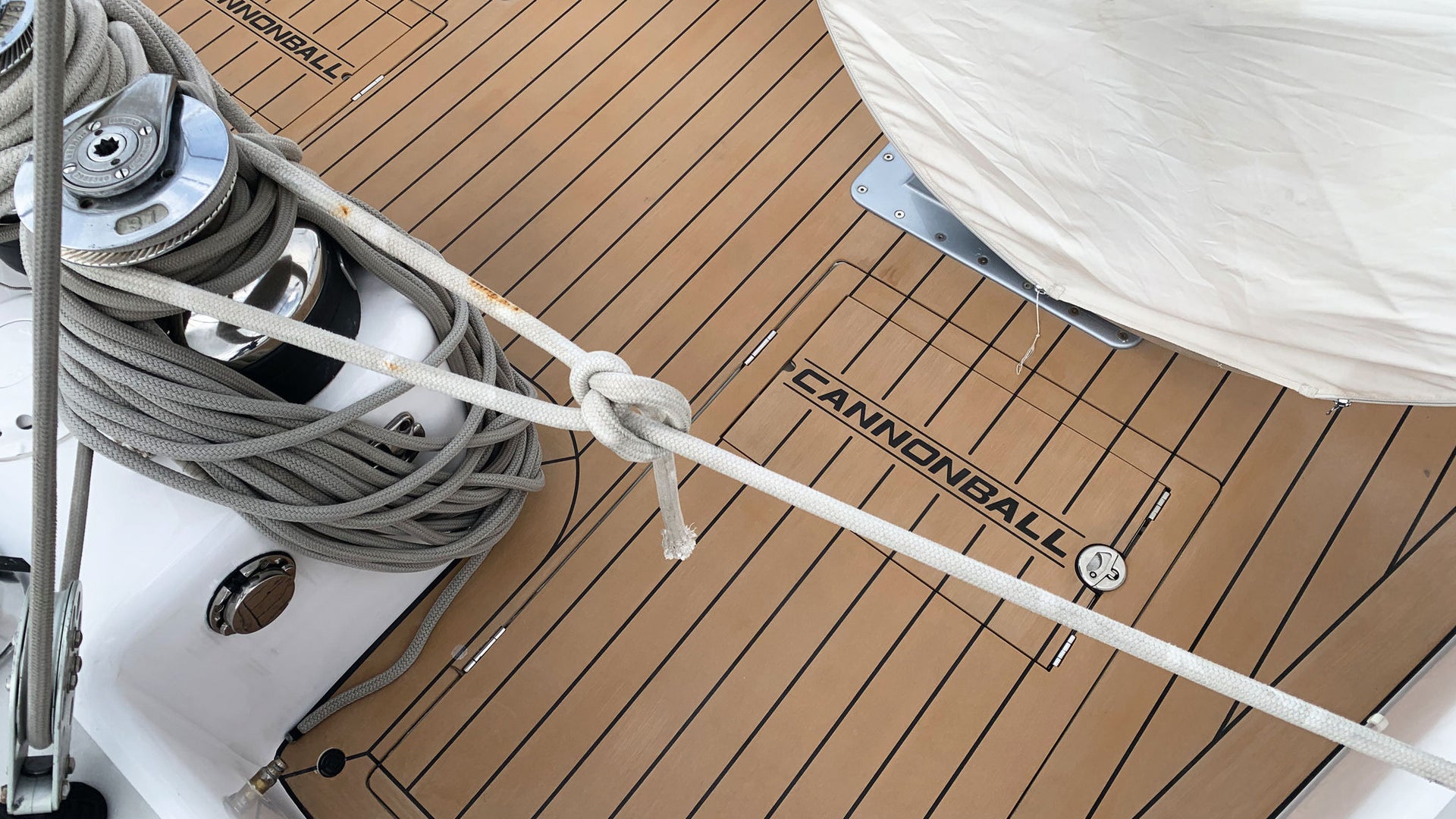 Sailboat deck with ropes and hatches