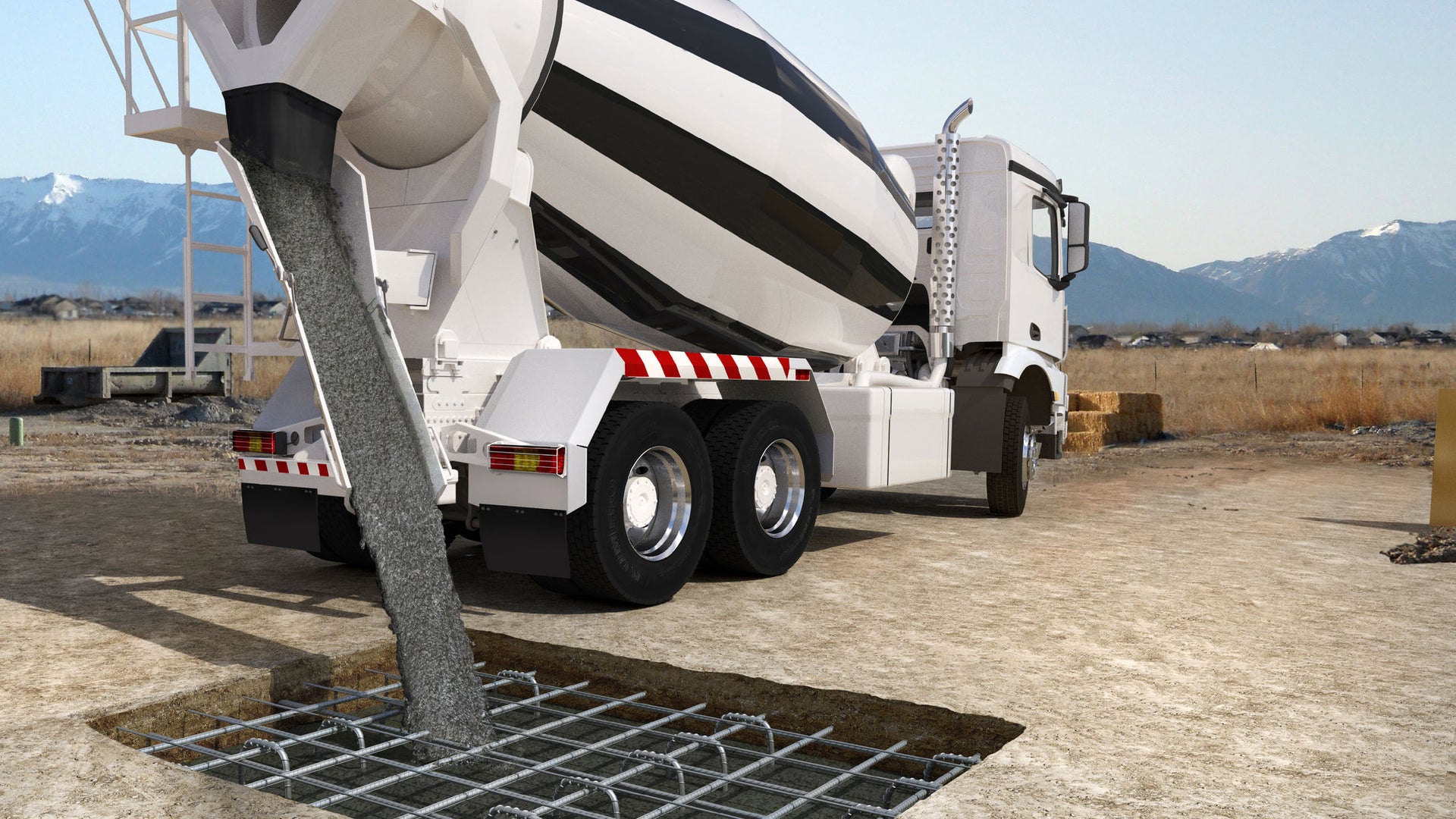 Concrete mixer vehicle empties concrete into a filling