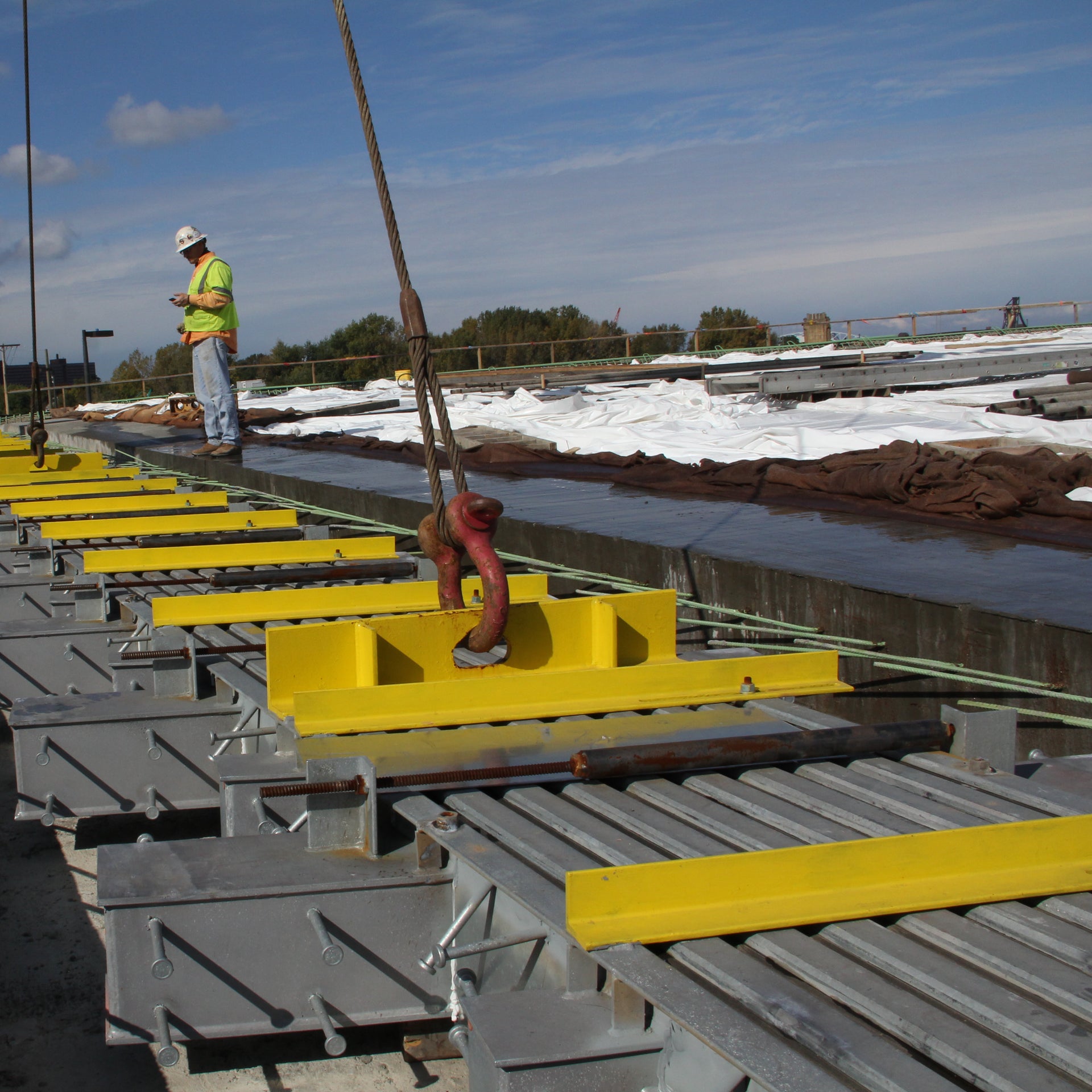 Construction workers installing structural steel beams