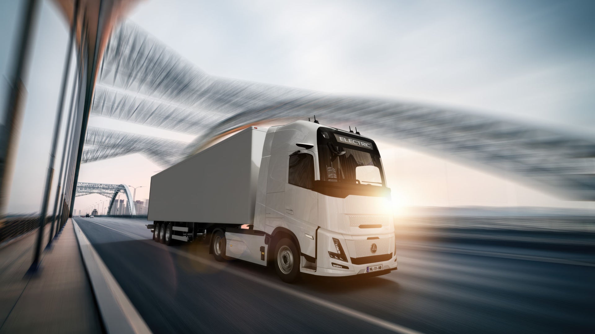 Modern white truck crossing a bridge