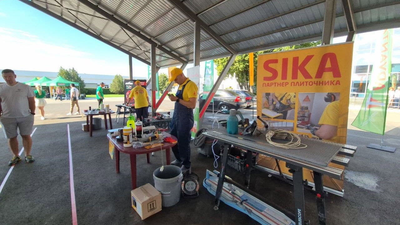 Outdoor Sika construction demonstration under canopy