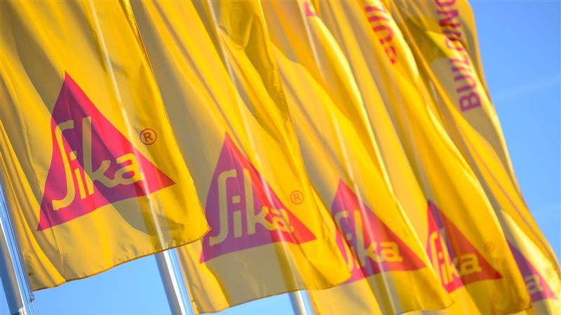 Multiple Sika Flags Waving in Bright Sunlight