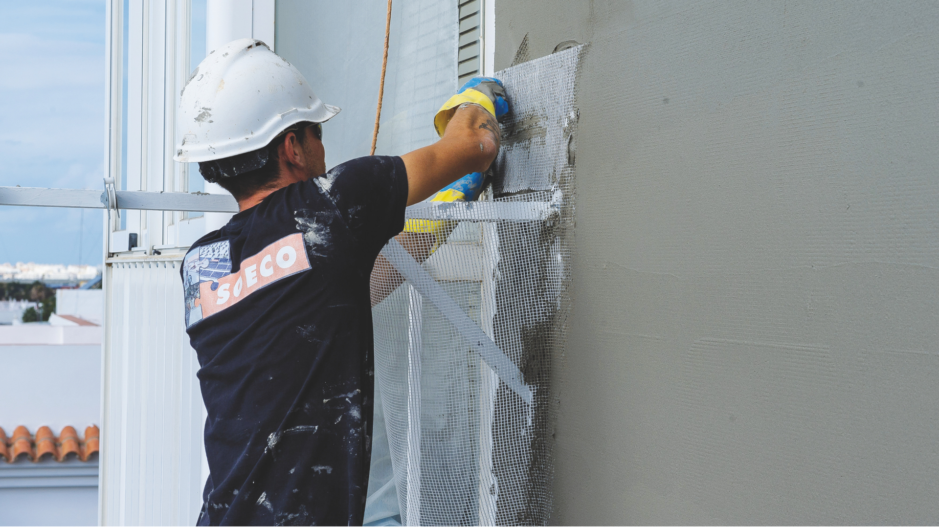 Construction worker applying wall plaster