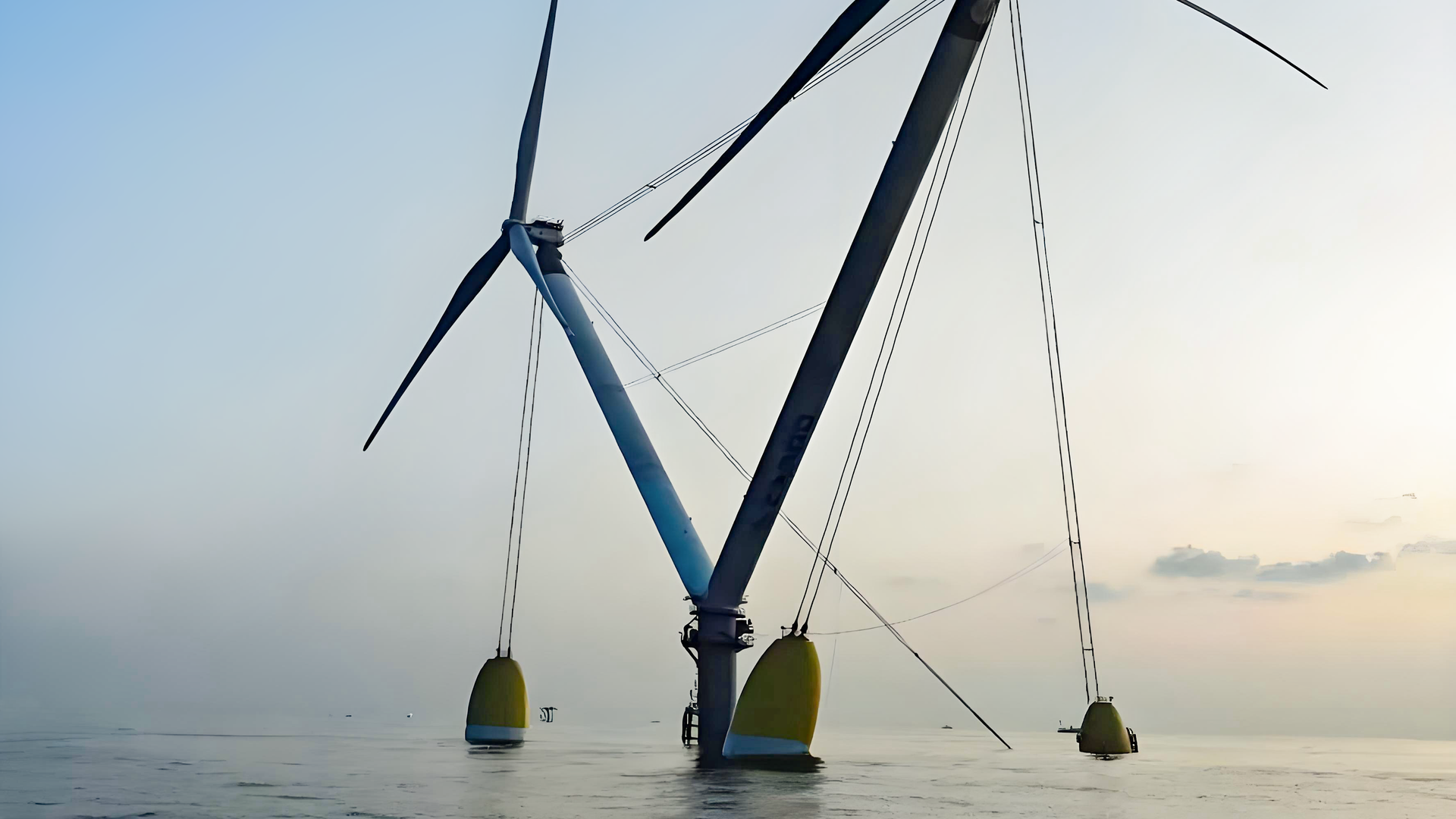 Offshore Wind Turbines at Sea During Sunrise