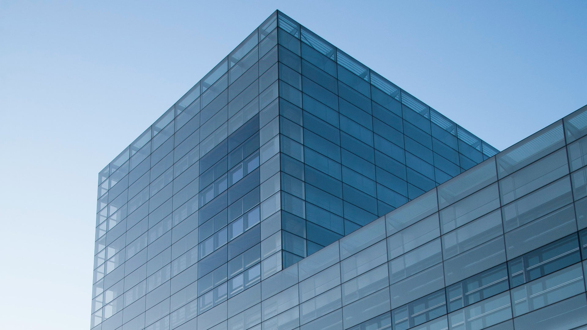 Modern glass building at dusk