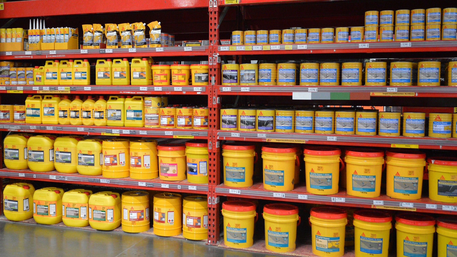 Yellow construction supply containers on store shelves