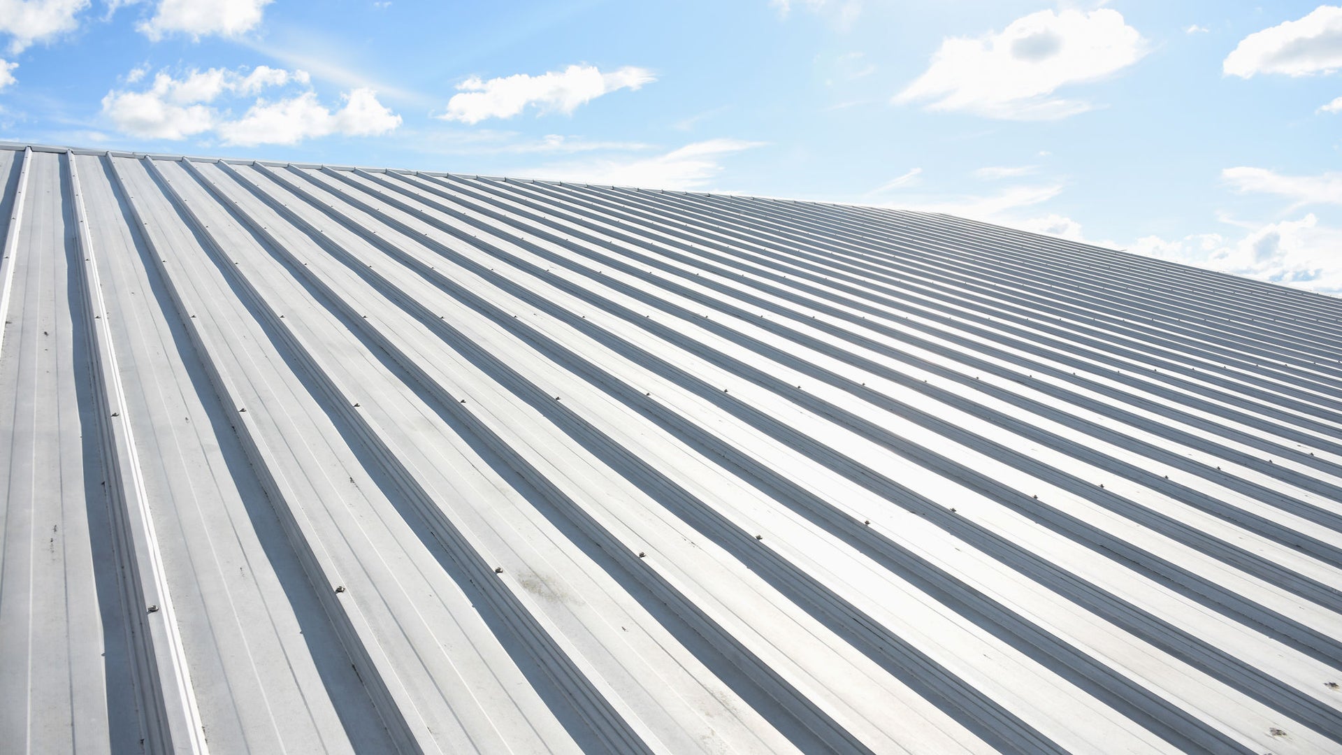 Metal roof panels under bright blue sky