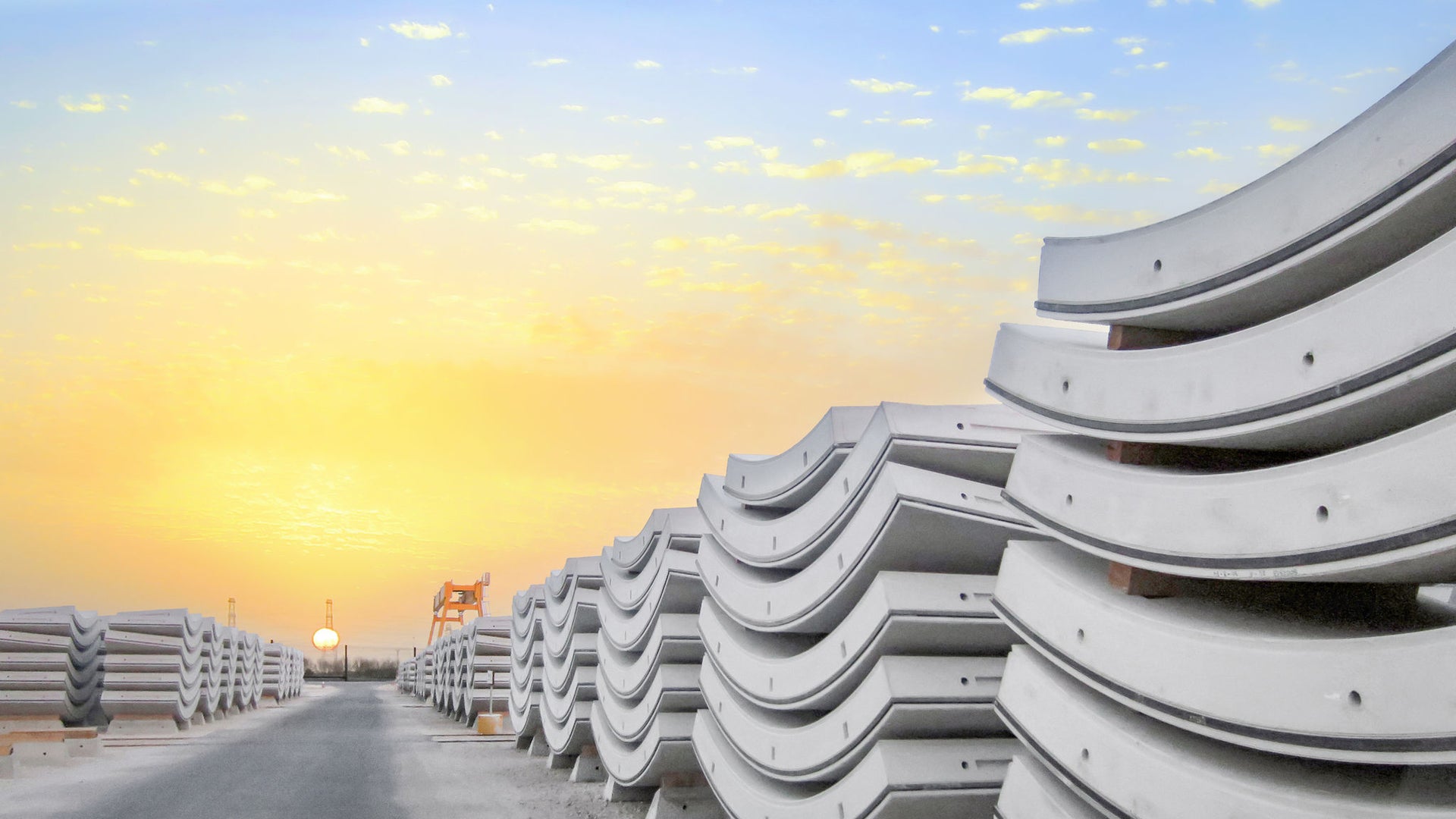 Stacked Concrete Tunnel Segments at Sunrise