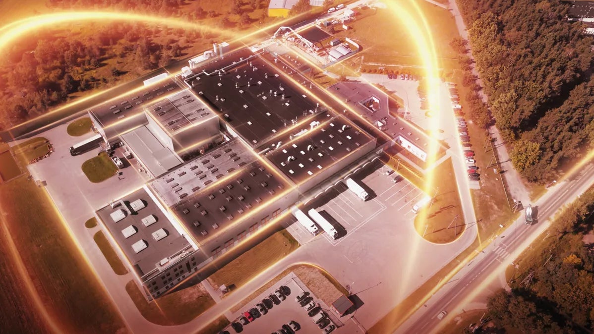 Aerial View of Modern Industrial Facility with Light Trails