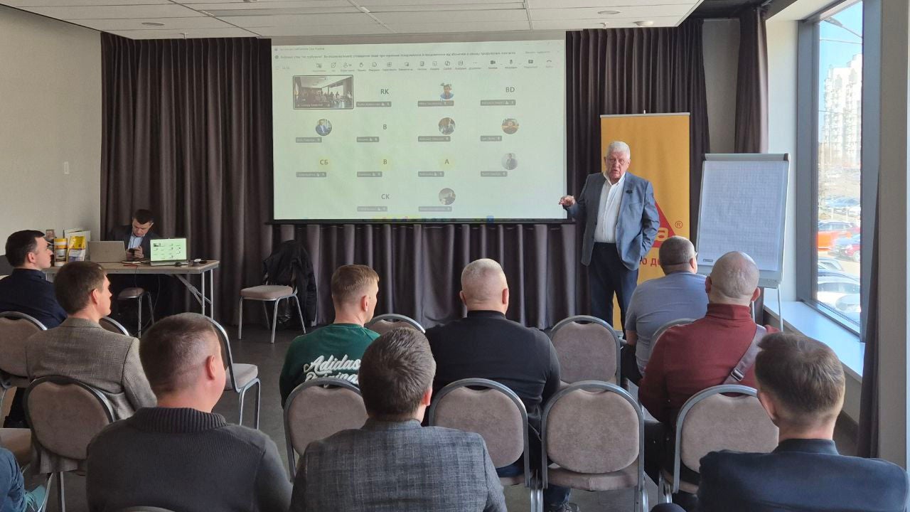 Business seminar with presenter and audience